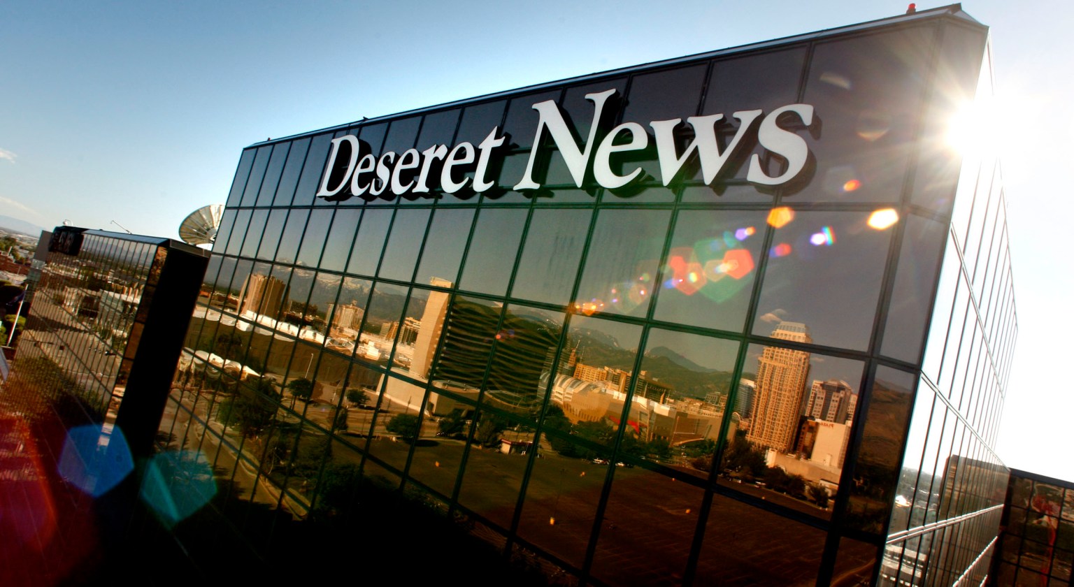 Young Electric Sign company workers install the new Deseret News sign Saturday, July 2, 2011 on the Triad Center.